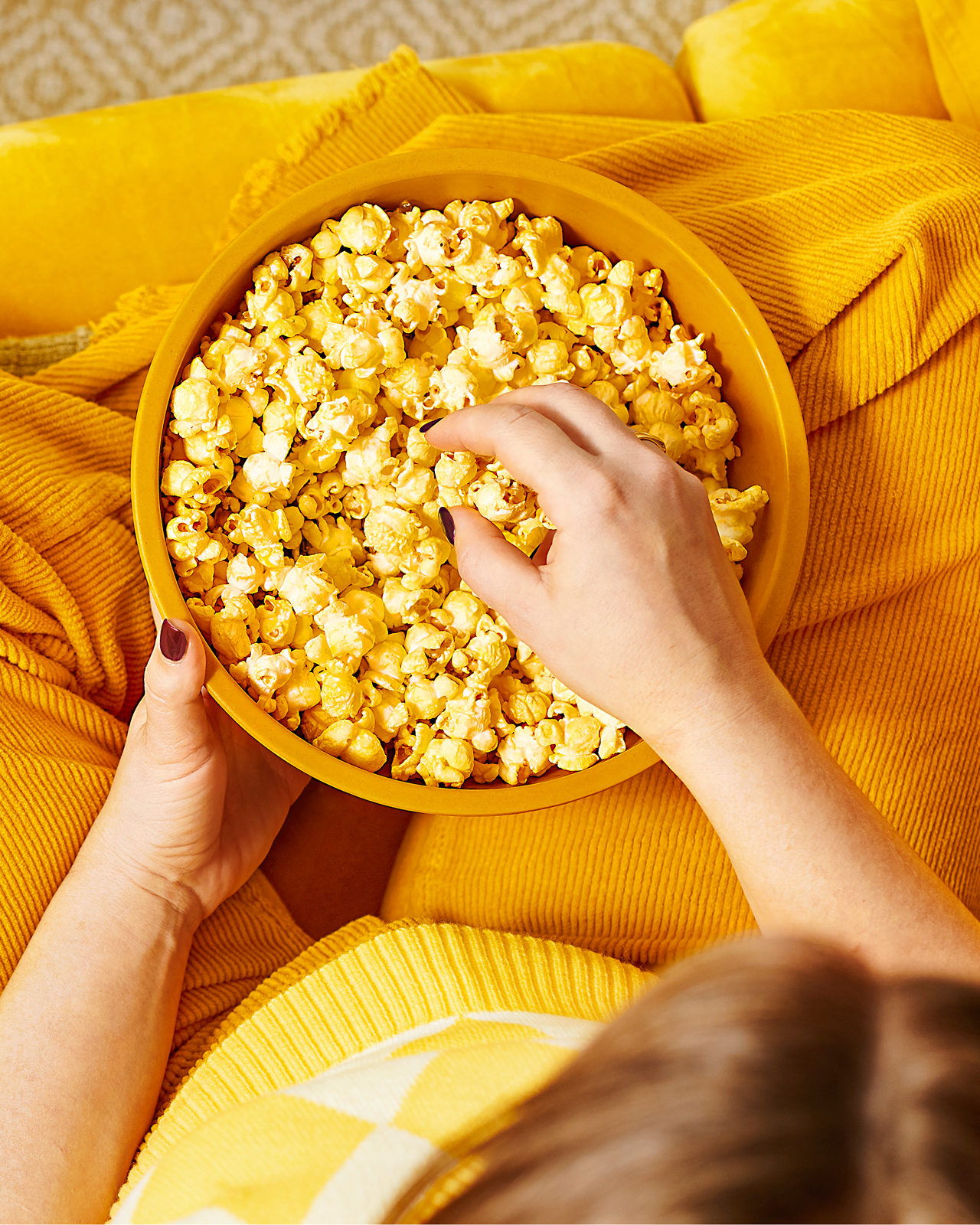 Person eating bowl of Magictime popcorn.